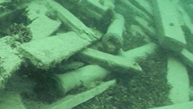An image captured by a remote operated vehicle shows two small cannons among the shipwreck.