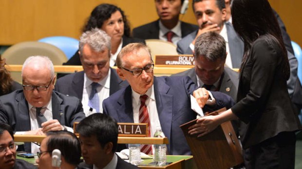 Former foreign minister Bob Carr (centre) casts his ballot during the UN vote to select five countries for positions on the UN Security Council.