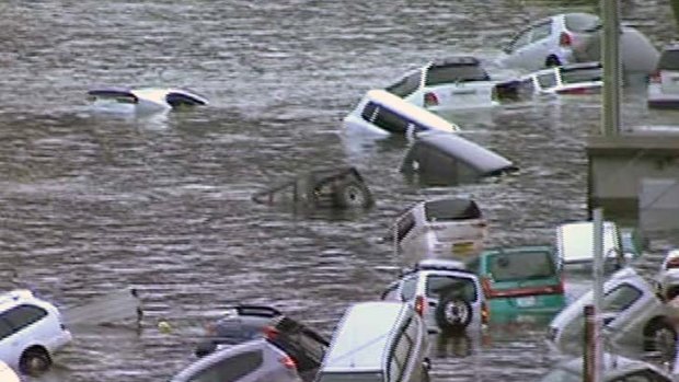 Cars are washed away by the tsunami that hit Japan in March.