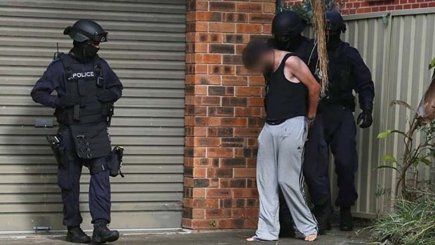 Raid: A 24-year-old man was arrested on Wednesday morning over the alleged murder of 20-year-old Dane McNeill.