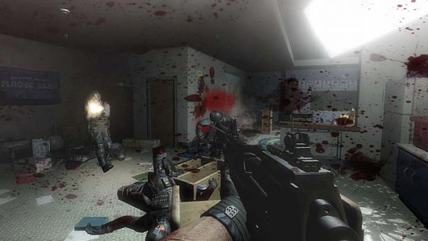 A weapon is raised in the first-person shooter  F.E.A.R. 2: Project Origin.
