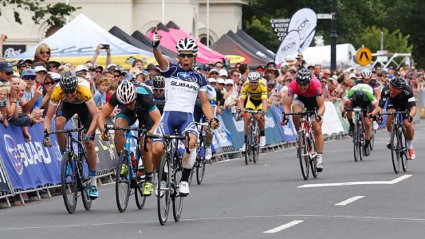 Pumped: Brenton Jones crosses the finish line to win the Bay Cycling Classic at Williamstown.