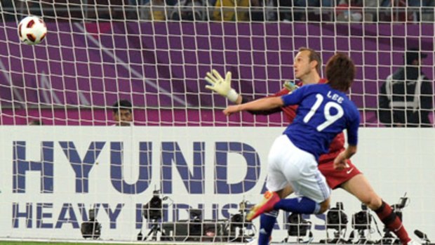 Japan striker Tadanari Lee beats Australian goalkeeper Mark Schwarzer to score the winning goal in the 2011 Asian Cup final.
