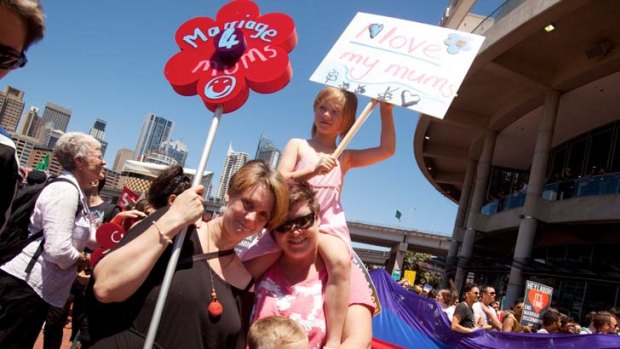 Lisa Saffery and partner Michele Saffery with their children at the rally in Sydney for gay marriage.