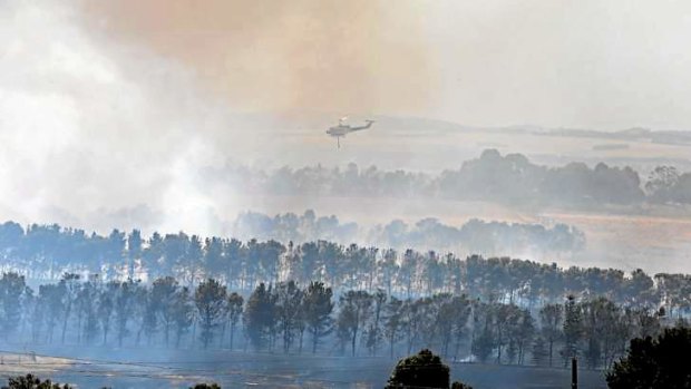 CFA fire crews battle a fire on a property in South Gisborne on Sunday.