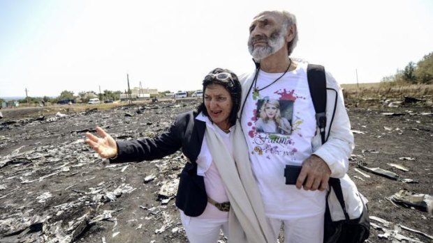 "A small possibility": The Dyczynskis at the MH17 crash site in eastern Ukraine.