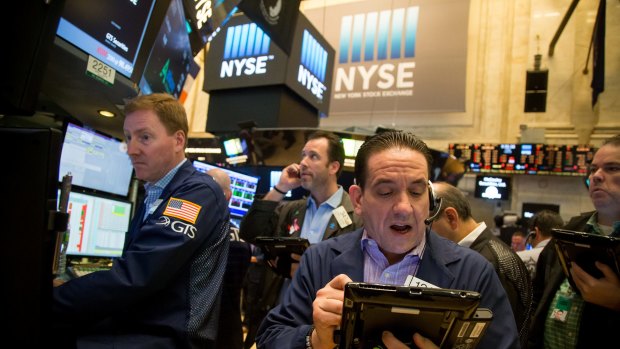 Jittery markets: Traders on the floor of the New York Stock Exchange (NYSE) on Friday.