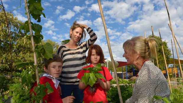 School parent Lauren Richardson (left) and Kingsville Primary School students Zoe Brown and Patrick Manning discuss horticulture with deputy principal Carolyn Withers. 