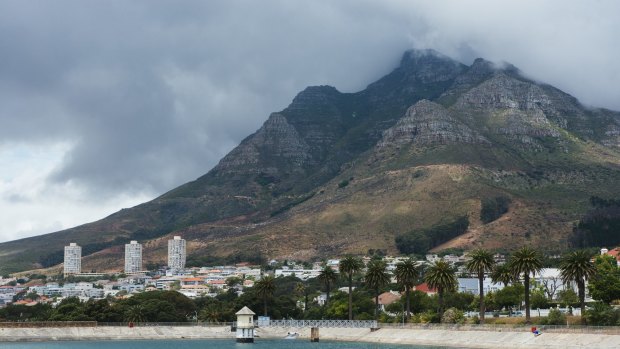 Water sits in the Molteno reservoir as Table mountain stands beyond in Cape Town, South Africa on Monday, Nov. 13, 2017. Cape Town has tightened water usage restrictions, banning the use of potable water to irrigate gardens, wash cars or top up swimming pools, as it confronts its worst drought on record and a delay to the onset of the winter rainy season. Photographer: Waldo Swiegers/Bloomberg