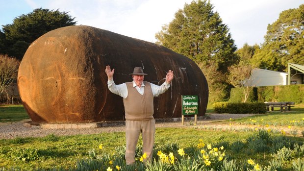  Big Potato builder Jim Mauger with the iconic landmark, which is now up for sale.