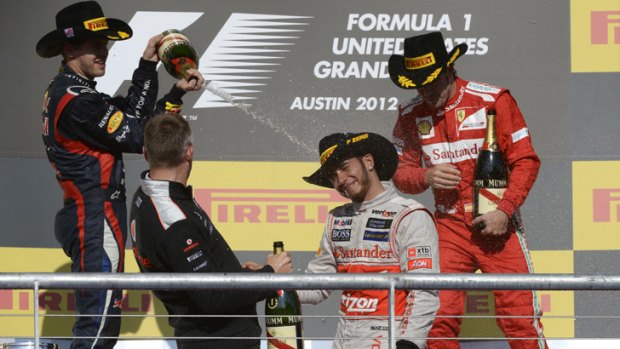 Britain's Lewis Hamilton cops a spray from Germany's Sebastian Vettel, after denying him the title in Texas on Sunday.