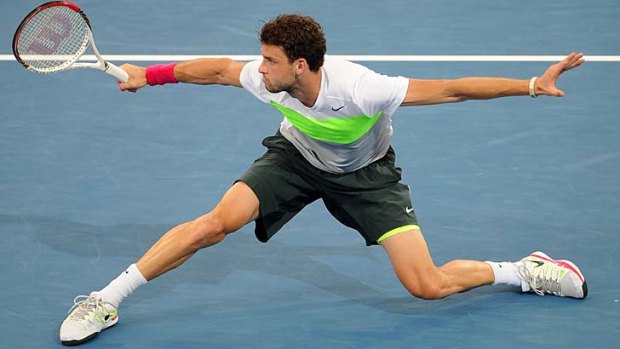 Young talent: Grigor Dimitrov, 21, of Bulgaria plays a backhand against Marcos Baghdatis, whom he beat in their semi-final match on Saturday in Brisbane.