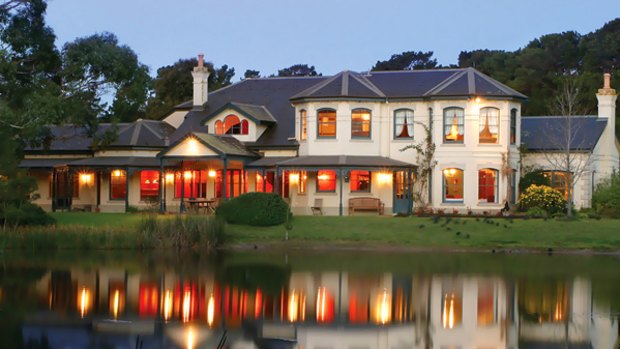 Peaceful reflection ... the gracious surrounds of Woodman Estate's lakeside house.