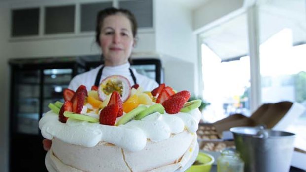 Sweet temptation ... Noga Maman, of Noga's Cuisine at Bondi, with a pavlova, which the Oxford English Dictionary has declared to be from New Zealand.