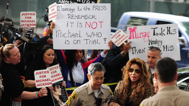 Tweeting 'conspiracies' ... La Toya Jackson arrives with police escort at the courthouse.