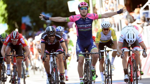 Italy's Sacha Modolo celebrates as he crosses the finish line to win the 17th stage of the Giro d'Italia.