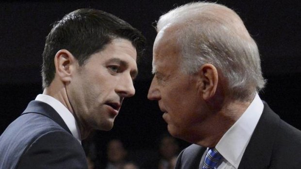 Hostilities ... Paul Ryan and Joe Biden exchange glances after the debate.