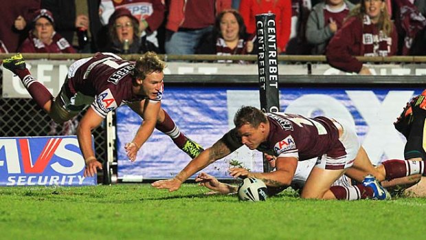 Cherry and Choc delight ... Anthony Watmough scores after a kick from Daly Cherry-Evans.