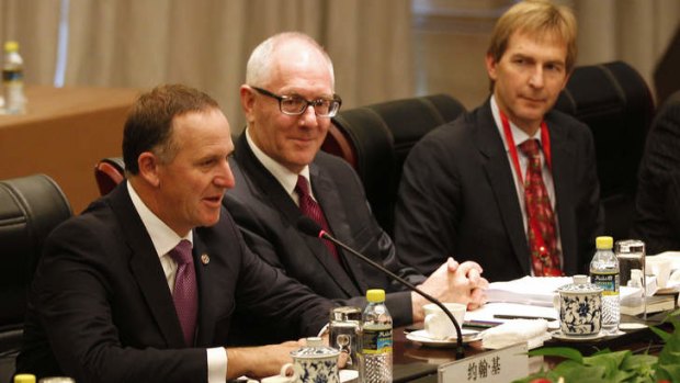 John Key, left, speaks during a meeting with China's President Xi Jinping (not pictured) in Bo'ao.