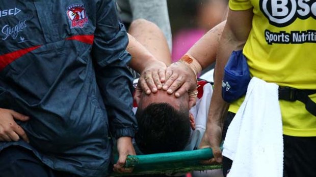 Distraught . . . Anthony Cherrington  is carried off.