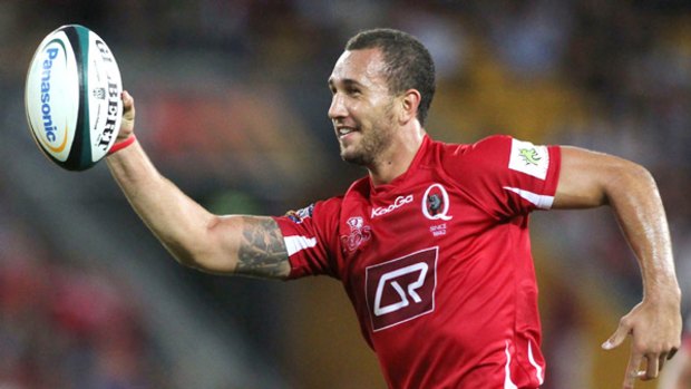 Quade Cooper celebrates as he crosses for a try.