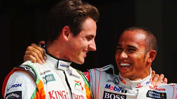 "Lewis is a coward" ... Adrian Sutil, left, does not want to be friends with Lewis Hamilton any more.