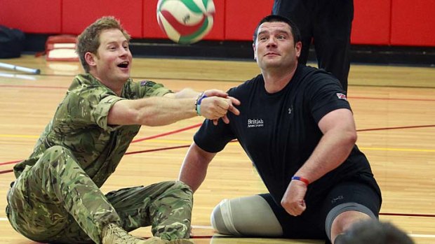 Healing: Harry plays sitting volleyball with soldiers at the Warrior Games.