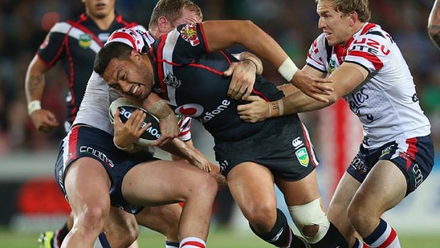 Force: Feleti Mateo is a handful for the Roosters.