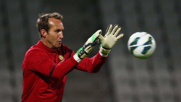 Clubless: Mark Schwarzer takes the ball during a Socceroos training session in Melbourne before the Jordan game.