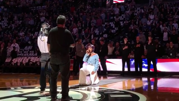 American singer Justine Skye took a knee during her performance of the US national anthem at an NBA game.