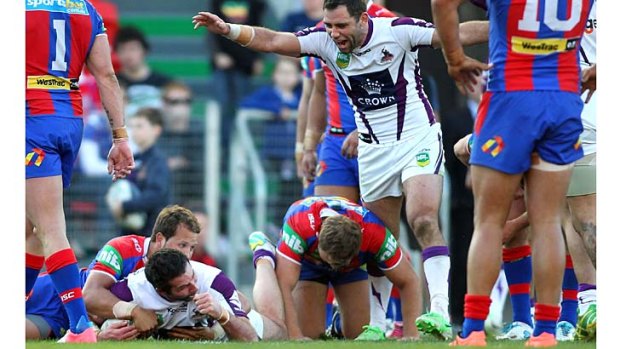 Line honours: The Storm breaks through with Bryan Norrie's try against the Newcastle Knights at Hunter Stadium.