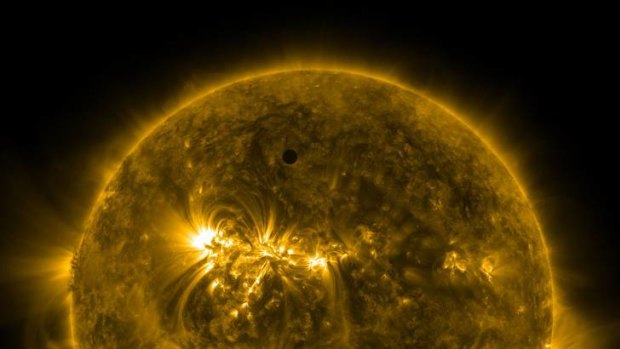Handout image courtesy of NASA shows the planet Venus transiting the Sun.
