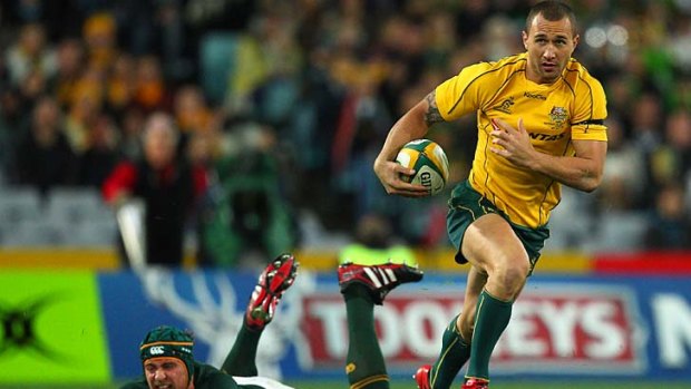 Quade Cooper sets off towards the tryline after using his freakish sidestep to leave a Springbok defender grasping at air.