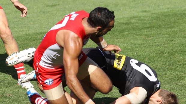 Adam Goodes reported for this contact with Port Adelaide's Jacob Surjan.