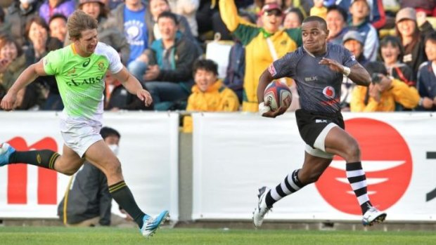 Title sprint: Waisea Nacuqu (R) runs away to score the winning try against South Africa.