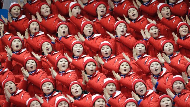 North Korean supporters sing ahead of the pairs free skate figure skating final.