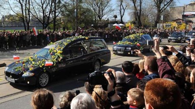 People pay their final respects to late Polish President Lech Kaczynski and his wife Marta.