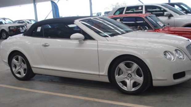 The 2007 Bentley convertible was one of four luxury cars auctioned off by the Oswals.