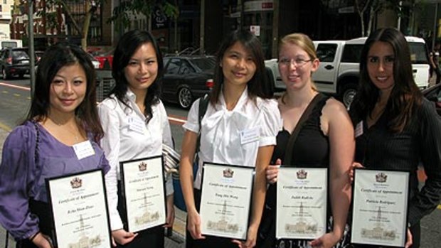 Brisbane international student ambassadors Echo Shan Zhao (China), Xiaoyan Xiong (China), Tung Hin Wong (Hong Kong), Judith Radicke (Germany) and Patricia Rodriguez (Brazil).