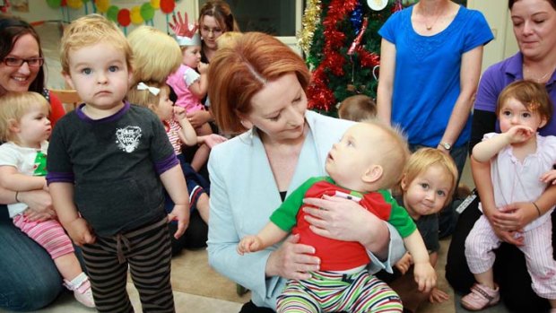 Role model ... Julia Gillard holds Alex Bucknall at the Parliament House childcare centre.