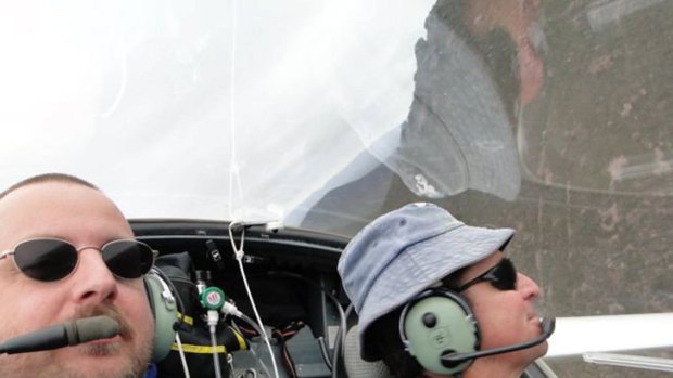 Alfred Rosche (left) takes a self-portrait while flying a glider with an unidentified friend around the Stirling Ranges yesterday. The following day, he fatally crashed into a mountain.