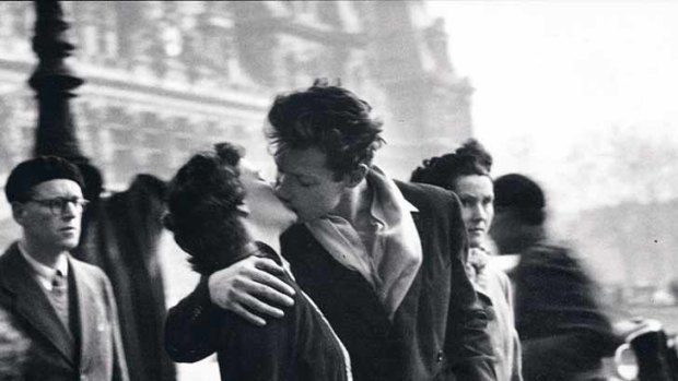Posed ... a photo taken by Robert Doisneau outside Paris city hall in 1950 featuring Francoise Bornet and Jacques Carteaud kissing.