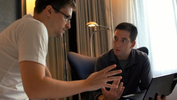 Edward Snowden talks with journalist Glenn Greenwald in a scene from the documentary <i>Citizenfour</i>.