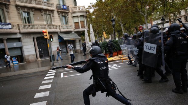 Spanish riot police used  rubber bullets against people trying to reach polling stations on October 1.