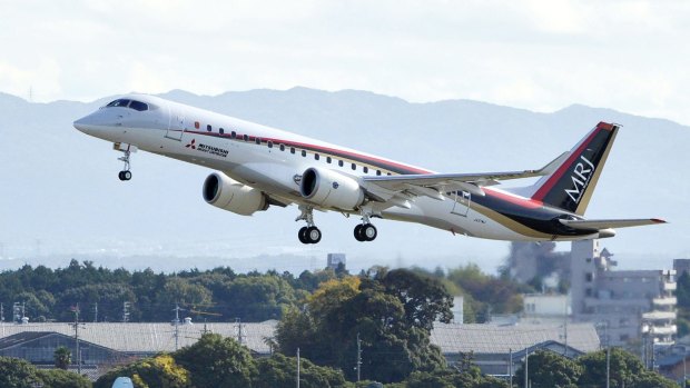 Japan's first domestically produced passenger jet, the Mitsubishi Regional Jet (MRJ), takes off from Nagoya Airport.