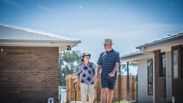 Lee and Jacqui Forster walk across their block of land in Throsby. 