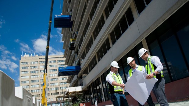 Sasha Mielczarek (far right) on the site of a Canberra project in 2013