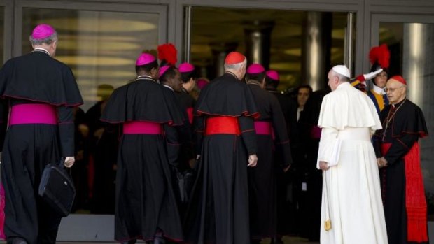 Pope Francis, right, arrives with bishops and cardinals at an afternoon session of the two-week synod on family issues at the Vatican on Saturday.