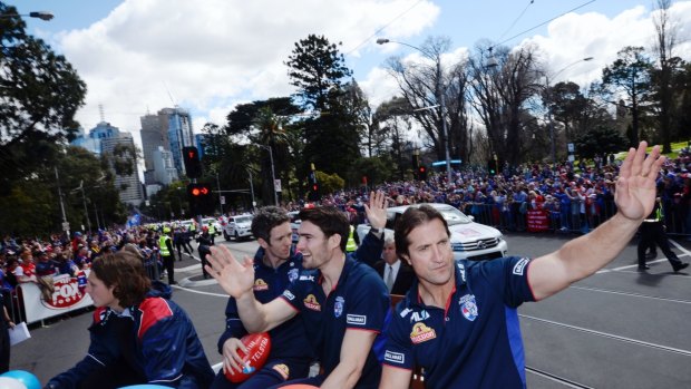 Luke Beveridge, Bob Murphy and Easton Wood take the plaudits from Western Bulldogs fans.