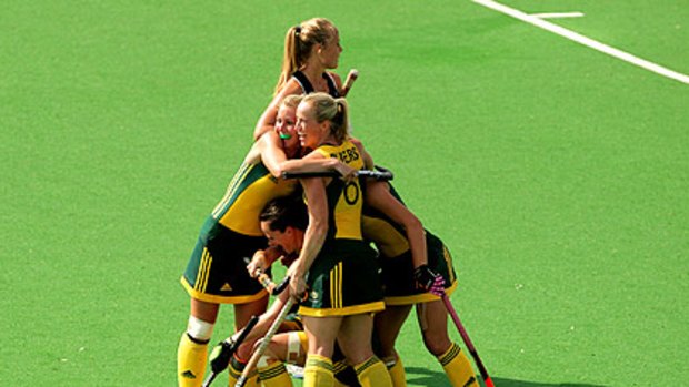 The Hockeyroos celebrate after Ashleigh Nelson's late goal in the women's final. The Hockeyroos won in a penalty shootout.